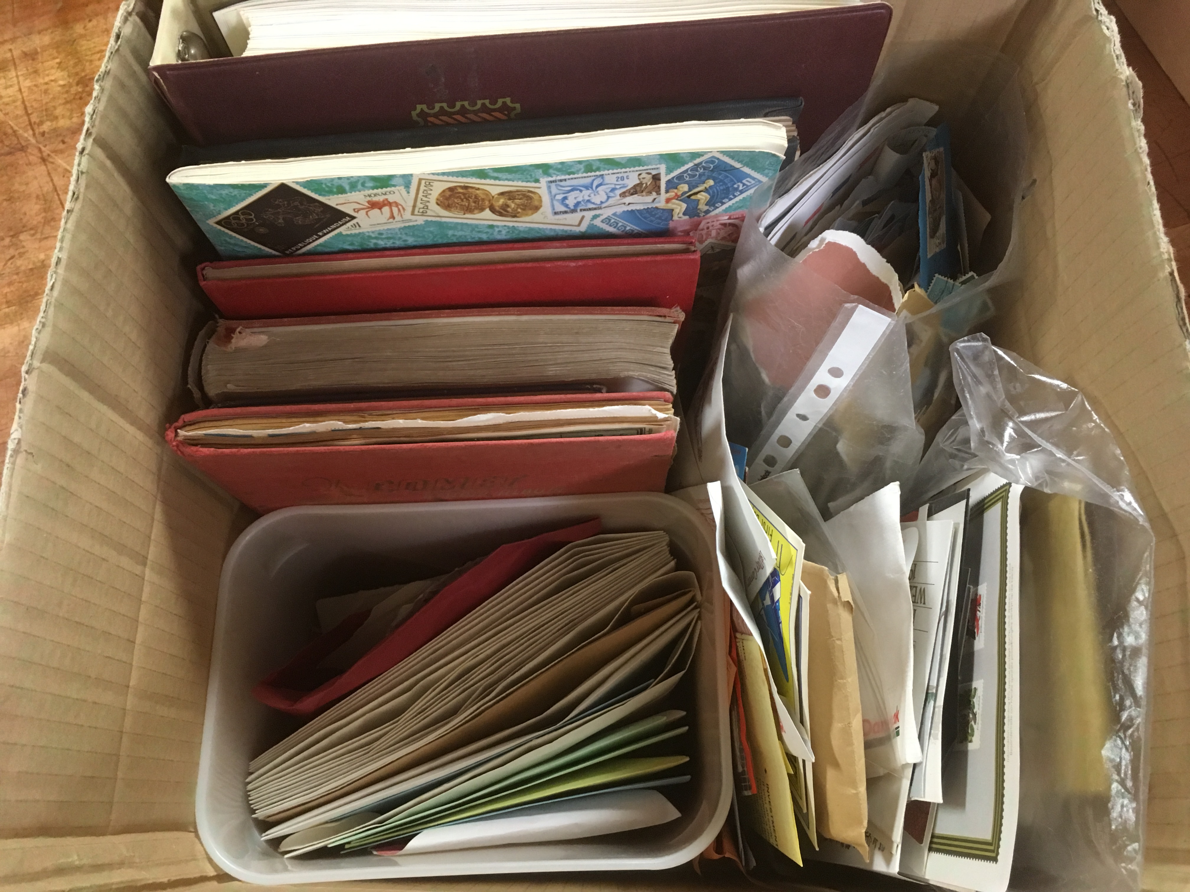 BOX WITH STAMP COLLECTIONS IN SEVEN ALBUMS, ENVELOPES AND LOOSE, A FEW COVERS, ETC.