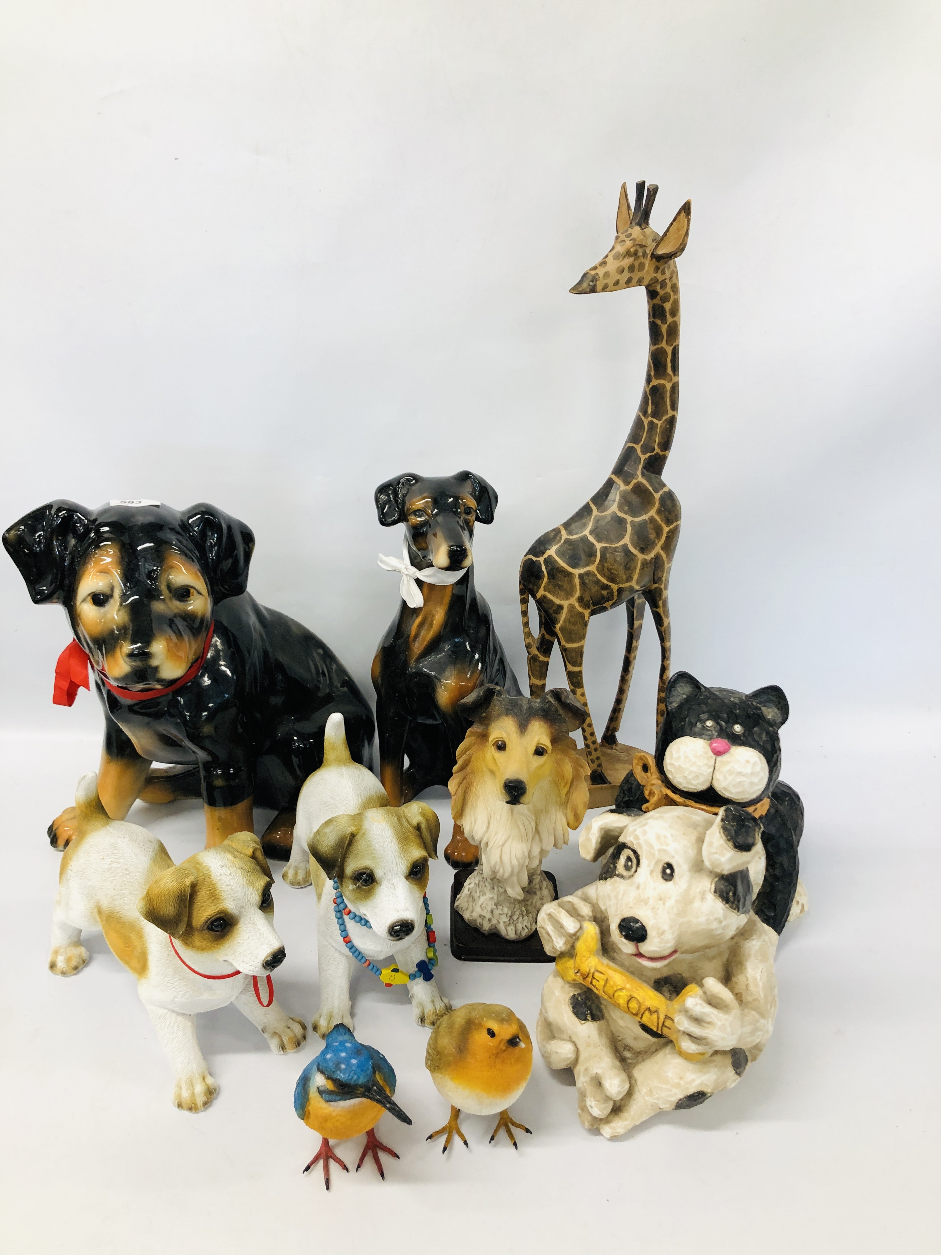 COLLECTION OF TREEN AND RESIN DOG AND CAT ORNAMENTS ALONG WITH A GIRAFFE,