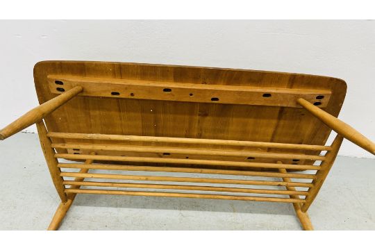 AN ERCOL STYLE BLONDE COFFEE TABLE LENGTH 104CM. WIDTH 47CM. HEIGHT 36CM. - Image 7 of 8