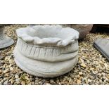 A STONEWORK "SACK" DESIGN GARDEN PLANTER.