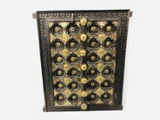 A HARDWOOD TWO DOOR HINGED PANEL/HATCH WITH STUDDED BRASS DETAIL HEIGHT 58CM. WIDTH 46CM.