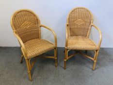 A PAIR OF CANE ELBOW CHAIRS