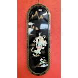 AN ORIENTAL LACQUERED WALL HANGING WITH RAISED MOTHER OF PEARL DECORATION HEIGHT 91CM. WIDTH 30CM.