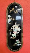 AN ORIENTAL LACQUERED WALL HANGING WITH RAISED MOTHER OF PEARL DECORATION HEIGHT 91CM. WIDTH 30CM.