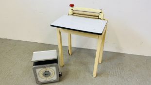 AN ENAMELLED FOLDING TOP TABLE WITH FOLD OUT FLEETWAY PRODUCTS MANGLE A/F ALONG WITH A SET OF AVERY