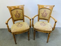 A PAIR OF ANTIQUE FINISH ELBOW CHAIRS WITH UPHOLSTERED SEATS AND BACKS