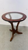 A GOOD QUANITY REPRODUCTION OCCASIONAL TABLE WITH BEVELLED INSERT GLASS TOP SUPPORTED BY THREE