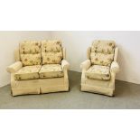 AN OATMEAL AND FLORAL UPHOLSTERED TWO PIECE LOUNGE SUITE COMPRISING OF TWO SEATER SOFA AND ARM