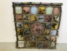 A VINTAGE STAINED AND LEADED GLASS PANEL WITH LEAF, FOLIAGE AND SONG BIRD DECORATION W 56CM, H 62CM.
