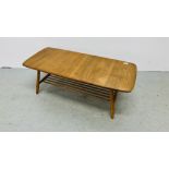 AN ERCOL STYLE BLONDE COFFEE TABLE LENGTH 104CM. WIDTH 47CM. HEIGHT 36CM.