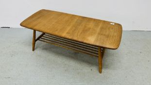 AN ERCOL STYLE BLONDE COFFEE TABLE LENGTH 104CM. WIDTH 47CM. HEIGHT 36CM.