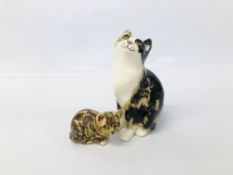 TWO WINSTANLEY "TORTOISE SHELL" CATS ONE SITTING HEIGHT 21.5CM, THE OTHER LAYING HEIGHT 8CM.
