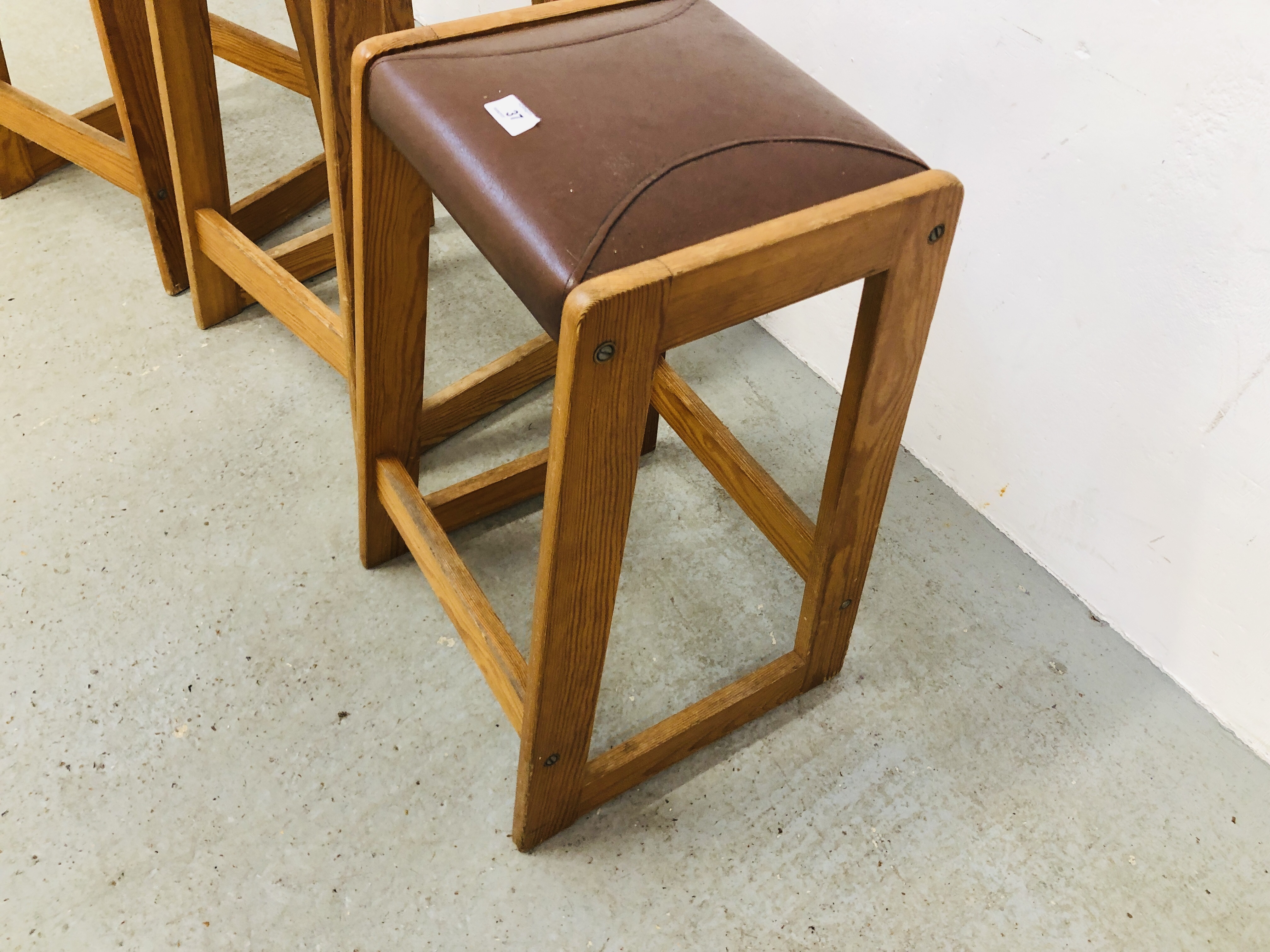 THREE PINE FRAMED BREAKFAST BAR STOOLS WITH BROWN LEATHER PADDED SEAT HEIGHT 62CM. - Image 2 of 4