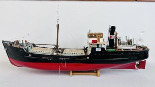 A SCRATCH BUILT WOODEN MODEL CARGO SHIP THE DECK FITTED WITH LIFEBOATS, WINCH MOVEMENTS,