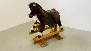 A MODERN CHILDS ROCKING HORSE WITH LEATHER SADLE