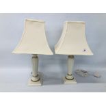 A PAIR OF CLASSICAL STYLED TABLE LAMPS WITH CREAM SHADES HEIGHT 50CM - SOLD AS SEEN.