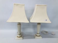A PAIR OF CLASSICAL STYLED TABLE LAMPS WITH CREAM SHADES HEIGHT 50CM - SOLD AS SEEN.