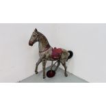 C19TH VINTAGE TIN HORSE ORIGINALLY FROM A FAIR GROUND RIDE.