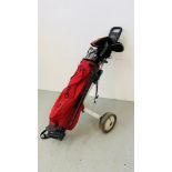 A "TAYLOR MADE" GOLF CADDY WITH A QUANTITY OF CLUBS TO INCLUDE TAYOR MADE, ROYAL, GEORGE NICOLL,