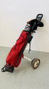 A "TAYLOR MADE" GOLF CADDY WITH A QUANTITY OF CLUBS TO INCLUDE TAYOR MADE, ROYAL, GEORGE NICOLL,