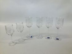 A SET OF FOUR ELEGANT WATERFORD MARQUIS WINE GLASSES PLUS TWO FURTHER GLASSES UNMARKED.