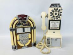 A "THE BIG EASY" JUKE BOX STYLE RADIO / CASSETTE PLAYER ALONG WITH A REPRODUCTION WILD AND WOLF
