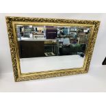 A GILT FRAMED WALL MIRROR WITH BEVELLED PLATE GLASS 60CM X 85CM.