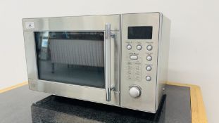 A STAINLESS STEEL MICROWAVE OVEN - SOLD AS SEEN.
