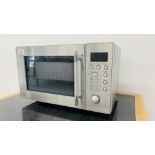 A STAINLESS STEEL MICROWAVE OVEN - SOLD AS SEEN.