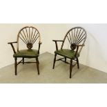 A PAIR OF HARDWOOD ELBOW CHAIRS WITH BOTTLE GREEN LEATHER UPHOLSTERED SEATS,