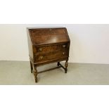 AN OAK TWO DRAWER DROP FRONT BUREAU