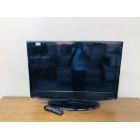 A VISUAL INNOVATIONS 32 INCH FLAT SCREEN TV COMPLETE WITH REMOTE - SOLD AS SEEN.
