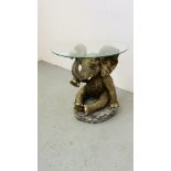 ELEPHANT OCCASIONAL TABLE WITH CIRCULAR CLEAR GLASS TOP.