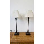 A PAIR OF MODERN BRASSED FINISH TABLE LAMPS WITH CREAM PLEATED SHADES - SOLD AS SEEN.