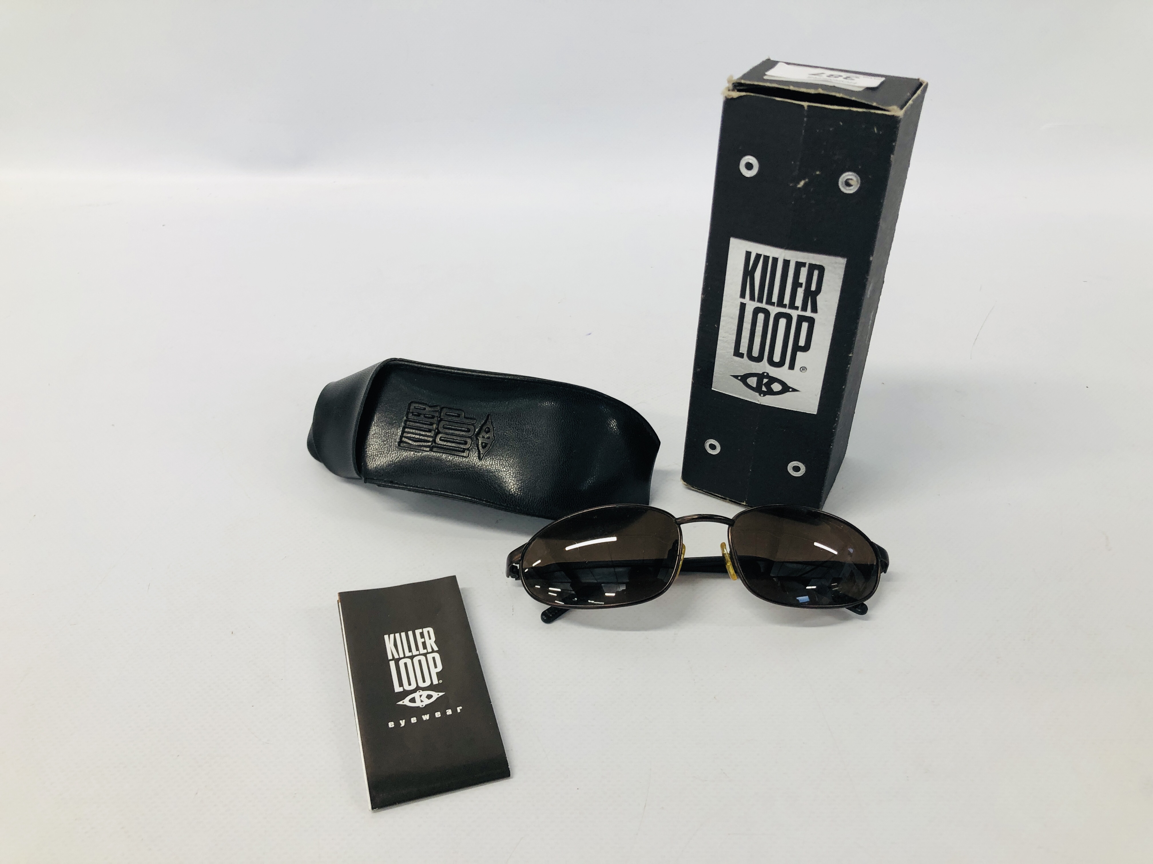 PAIR OF DESIGNER SUN GLASSES MARKED "KILLER LOOP"