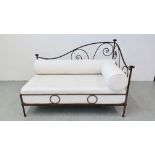 A FRENCH STYLE METALCRAFT CHAISE LOUNGE WITH CREAM UPHOLSTERED BASE AND BOLSTER CUSHIONS LENGTH