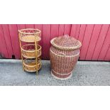 A WOVEN WICKER LAUNDRY BASKET WITH COVER,
