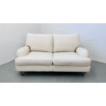 A MODERN CREAM LINEN UPHOLSTERED TWO SEATER SOFA LENGTH 160CM.