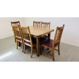 GOOD QUALITY EXTENDING OAK DINING TABLE WITH SIX MATCHING DINING CHAIRS WITH TAN LEATHERED SEATS