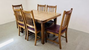 GOOD QUALITY EXTENDING OAK DINING TABLE WITH SIX MATCHING DINING CHAIRS WITH TAN LEATHERED SEATS