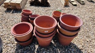 A COLLECTION OF 80 TERRACOTTA FLOWER POTS AND STANDS OF VARYING SIZES.