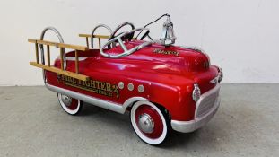 A CHILD'S RIDE ON TIN FIRE ENGINE WITH "FIRE FIGHTERS ENG23" DOWN THE SIDE AND "F.