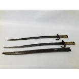 TWO ANTIQUE BRASS HANDLED FRENCH BAYONETS ONE HAVING SCABBARD, ONE STAMPED T.H.