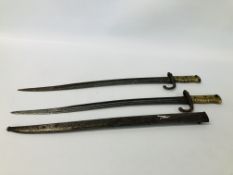 TWO ANTIQUE BRASS HANDLED FRENCH BAYONETS ONE HAVING SCABBARD, ONE STAMPED T.H.