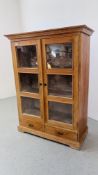 A PINE TWO DOOR SHELVED CABINET WITH TWO DRAWERS TO BASE W 111CM, D 50CM, H 150CM.