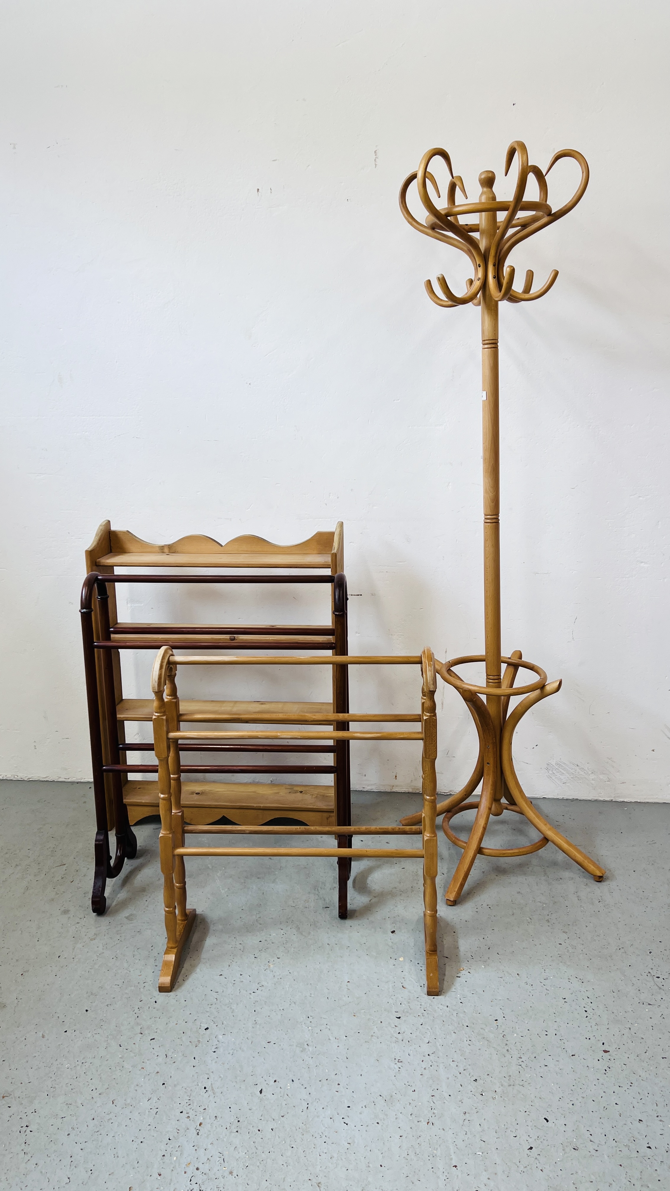 A MODERN BEECH WOOD REVOLVING COAT STAND ALONG WITH A PINE OPEN BOOK SHELF WIDTH 72CM. DEPTH 17CM.