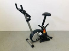 A PRO FITNESS EXERCISE BIKE WITH DIGITAL DISPLAY ALONG WITH A 6 SECOND AB TRAINER - SOLD AS SEEN.