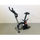 A PRO FITNESS EXERCISE BIKE WITH DIGITAL DISPLAY ALONG WITH A 6 SECOND AB TRAINER - SOLD AS SEEN.