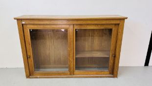 A LARGE SOLID OAK CABINET WITH TWIN SLIDING GLASS DOORS W 198CM, D 44CM, H 126CM.