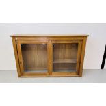 A LARGE SOLID OAK CABINET WITH TWIN SLIDING GLASS DOORS W 198CM, D 44CM, H 126CM.